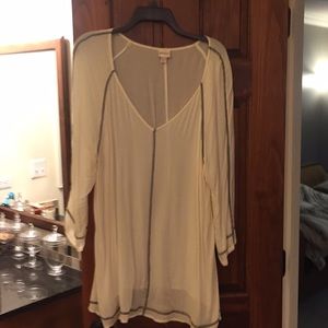 Off white draping top accented in black